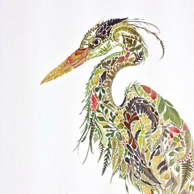 Collage artwork created with leaves and petals to form an image of a heron facing left against a white background
