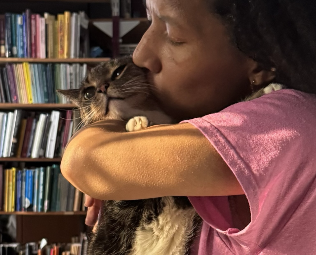 Pica tries to avoid the kiss