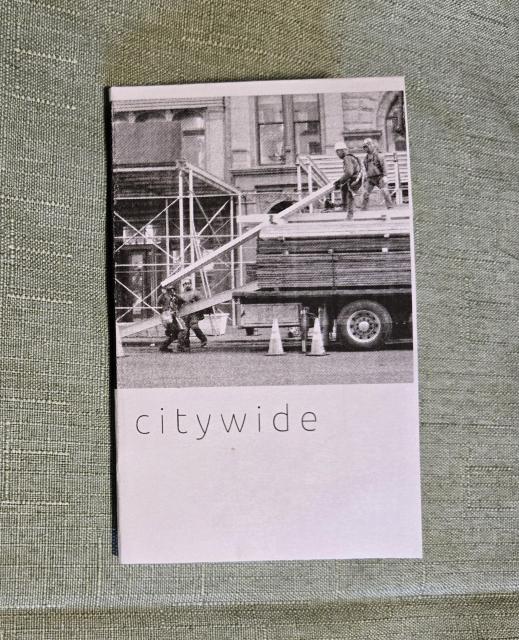 First page of a zine. The title "citywide" is printed beneath a square photo of construction workers.