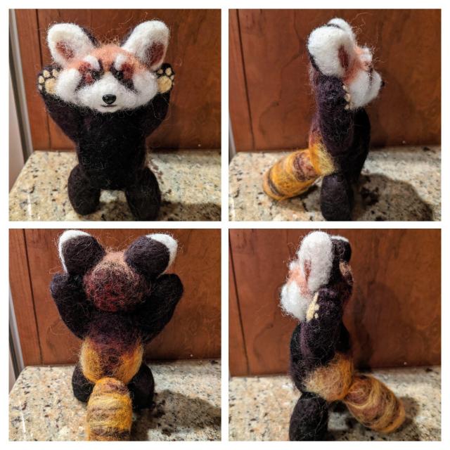 Four different views of a needle felted sculpture of a Red Panda making a scary expression. It is standing with its paws up and has a scary face.