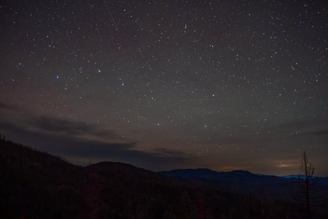 Starry skies over a mountainy landscape. [Fuji X-T5 / Viltrox 13 1.4]