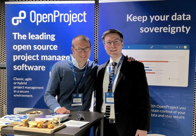 Robin Wagner and Lucas Knechtel from OpenProject welcoming visitors at the OpenProject booth during Nextcloud Enterprise Day in The Hague.