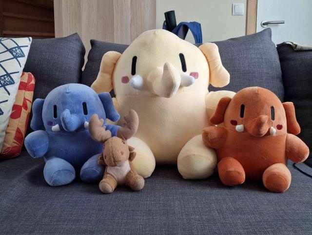 The plushtodon family is welcomed by Mr Moose 