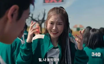 Scene from Squid Game, one of the character is going like "omg!"