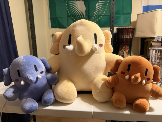 Three Mastodon plushies! Bigger one is in the middle while the two smaller ones are on either side.