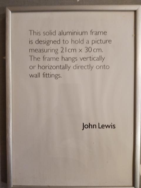 Is factory fresh John Lewis picture frame with product description inside that looks a bit like an inspirational quote.
