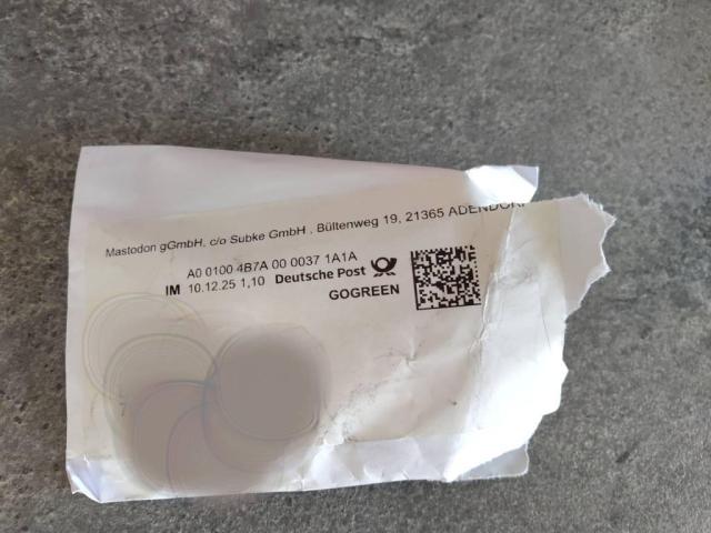 Teared-open Envelope that shows local German shipping.