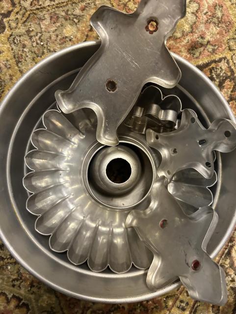 Cookie cutters- tin- man, woman, soldier in a tin Bundt tin