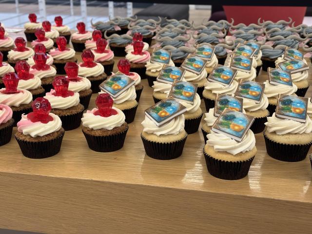 Closer view of the pacifier, Lynxley journal, and Bogo-shaped cupcakes.
