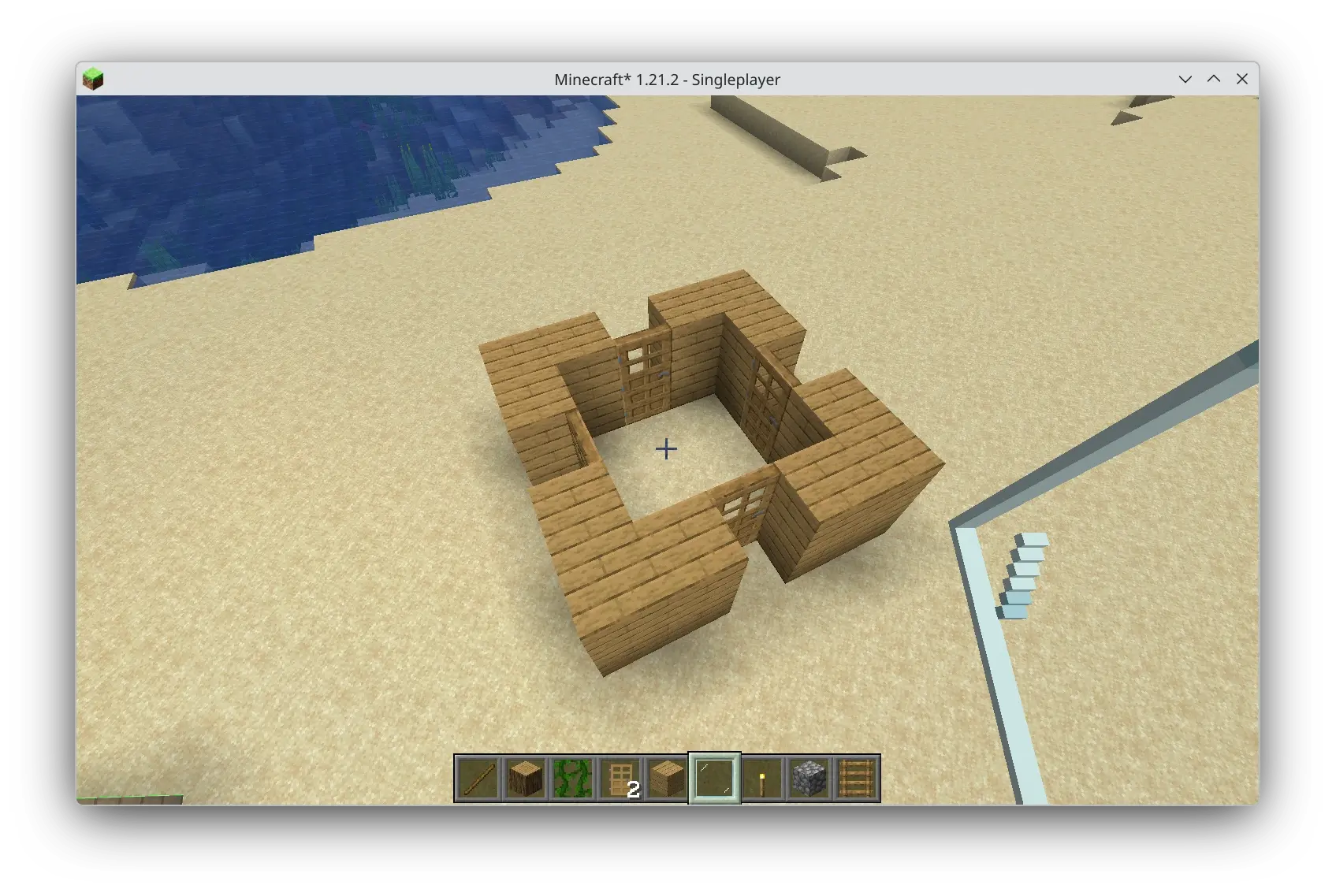 a minecraft structure: a square arrangement of planks with doors in each cardinal direction