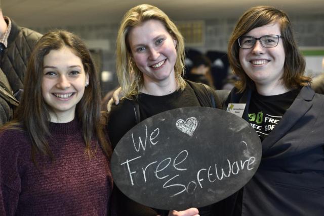 Three smiley people hold up a sign that says "We ❤️ Free Software" at FOSDEM 2019.

Photo credit: Redazione Cultura. distributed under CC By SA license. Find the original and more at https://www.dgpixel.com/techblog/i-love-free-software-day-2019/