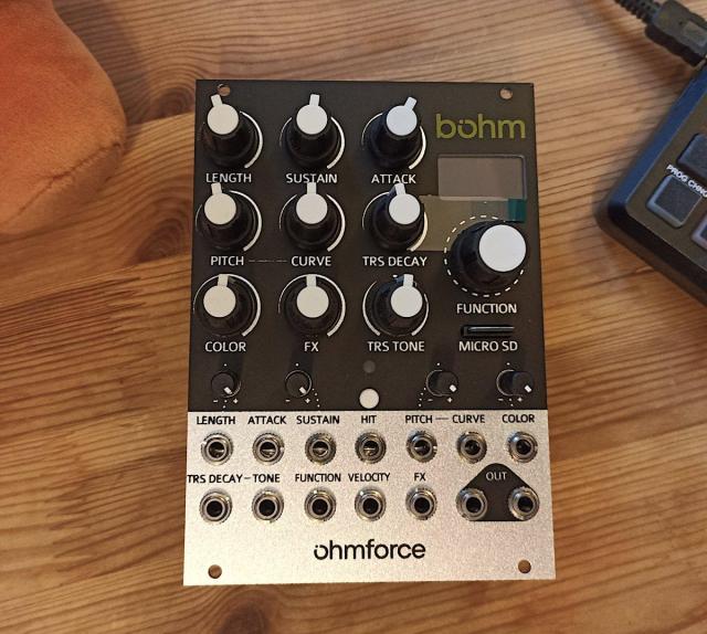 Photo of the Eurorack module Bohm from Ohmforce on a desk. Next to it you can see the foot of the Mastodon stuffed animal mascot and a piece of a MIDI controller.