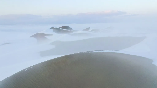 Dunes covered in snow.