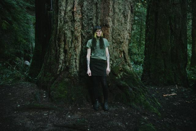 photo of me in front of a large douglas fir in the middle of a lush pacific northwest rainforest