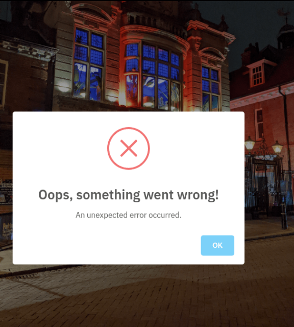 Screenshot of a huge infantile "Oops! Something went wrong" pop up error message over a photo.