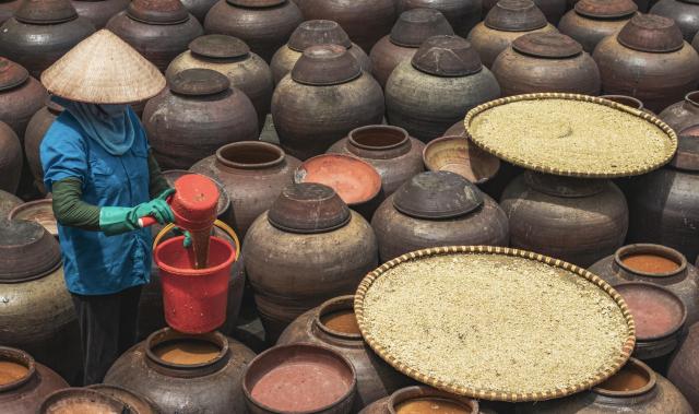 soy sauce makers in vietnam mixing ingredients 