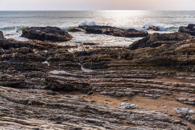 Layered rocks leading out in to the sea. [Fuji X-T5 / Sigma 17-40 1.8]