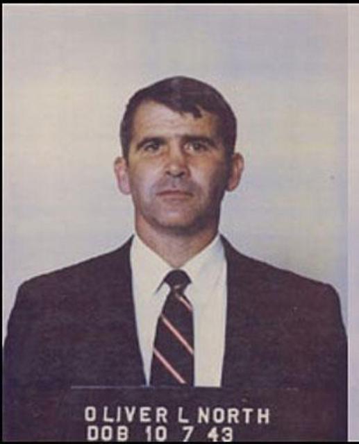 Ollie North's mugshot from his arrest related to the Iran-Contra Affair