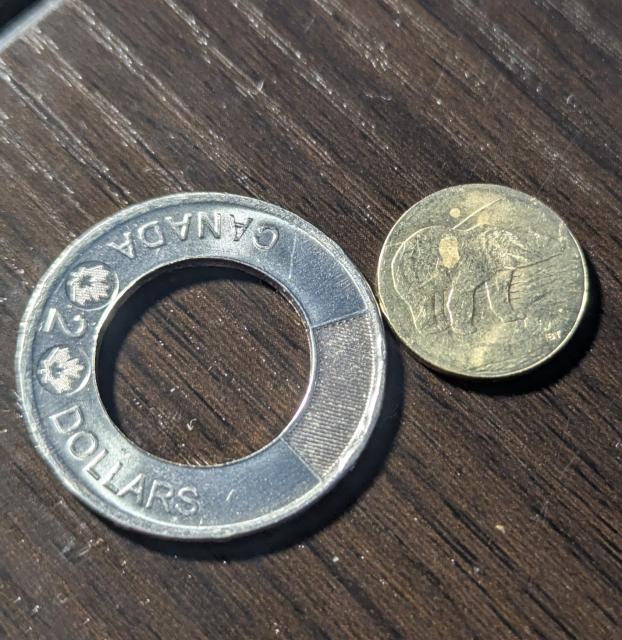 The 2 parts of the coin next to eachother