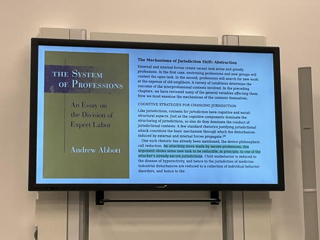 Slide showing the cover and excerpts from “The System of Professionals” by Andrew Abbott.
