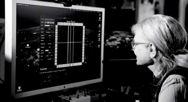 Laurie Spiegel in front of a remake of Music Mouse