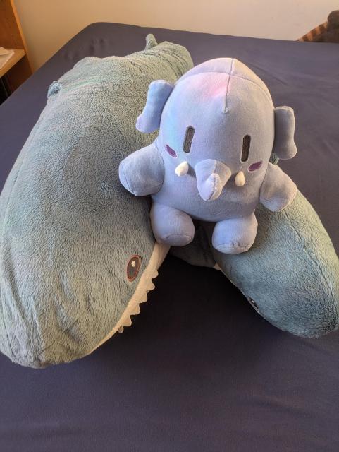 Picture of two plush sharks and one plushtodon.
