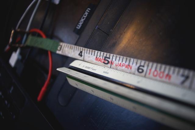 In comparison with an actual inch.