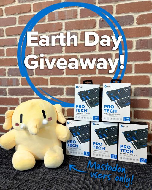 Graphic reading “Earth Day Giveaway!” over a brick wall background, with a blue circular outline around the text. Below, several iFixit Pro Tech Toolkit boxes are stacked on a table, alongside a yellow plush character. Handwritten-style text at the bottom says “Mastodon users only!” with an arrow pointing toward the toolkits.