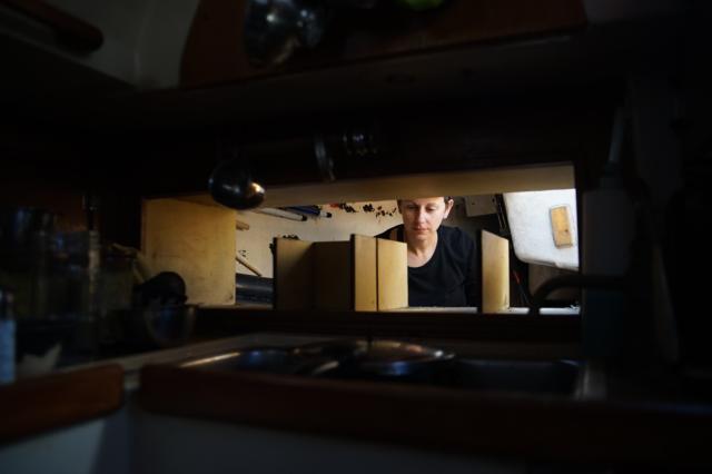 Looking inside the cockpit locker from the galley, a wild Rek appears.
