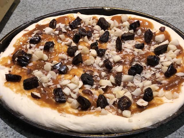 Oblique angle shot of a sweet pizza.