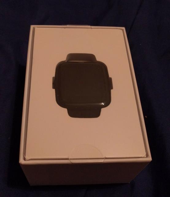 PineTime smart watch in its white box.