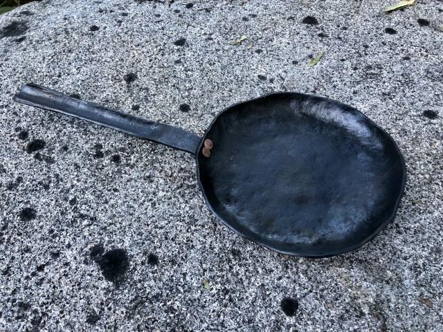 A small frying pan or skillet hand forged from mild steel. 
