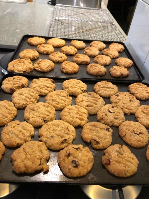 Two trays of baked biscuits. 