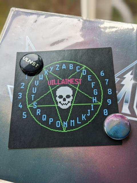 Villainest sticker and pins. 