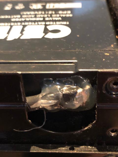 Terminal on an SLA battery, covered in hot glue. 