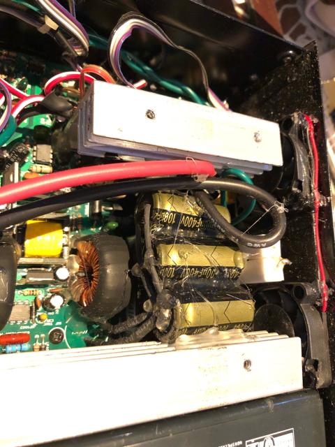 A bank of 400V 100uF capacitors, slathered in hot glue. 