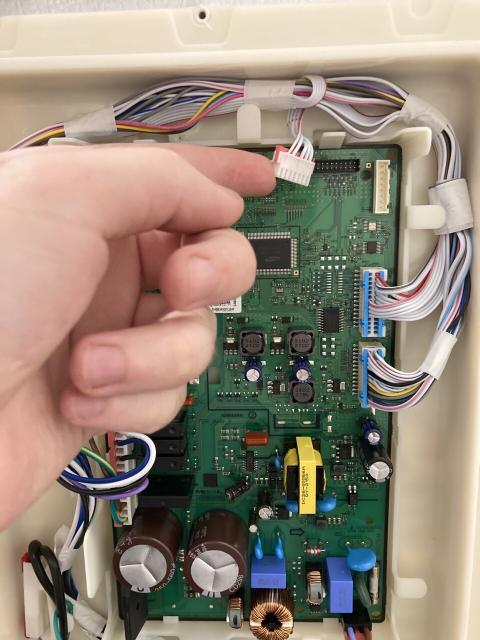 this little PCB i found under and access panel behind my dumbass fridge, one little connector is unplugged and i am pointing at it