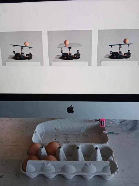 An egg-balancing robot by Niels, an imperfect machine that breaks eggs sometimes.