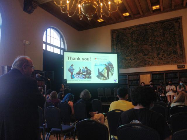 Peter Palasi is at the mike. The Thank  you slide has an image of one of the sampling outings rendered by one of the students.