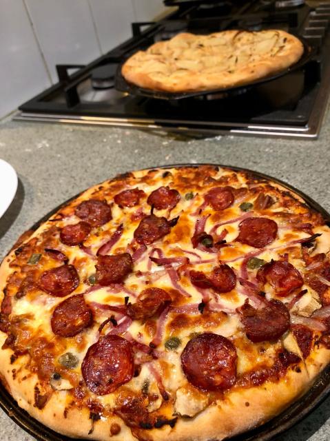 Standard red based mushroom, bacon, salami pizza