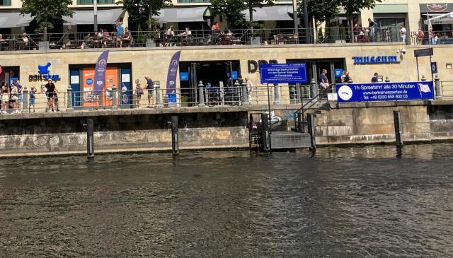 River in foreground, backed by “museum”