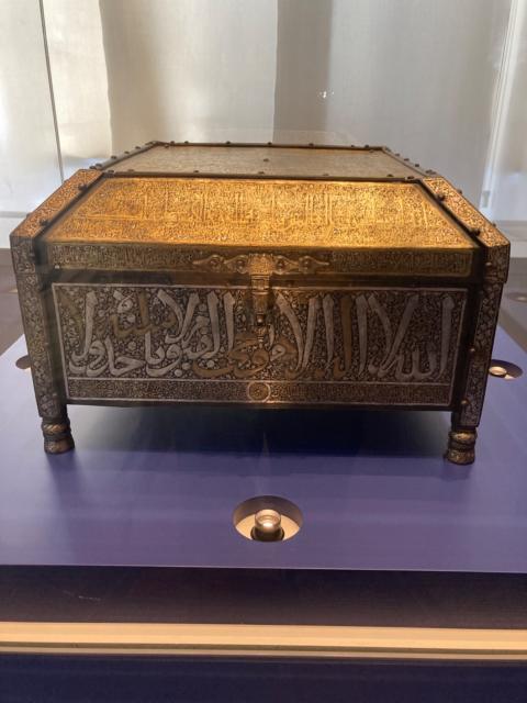 metal case with fancy embossed Arabic calligraphy 
