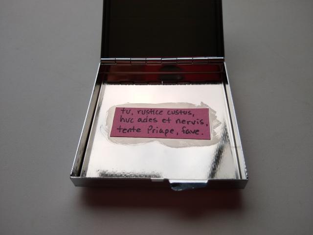 The inside of the box. More text handwritten on a strip of pink notecard, transcription to follow.