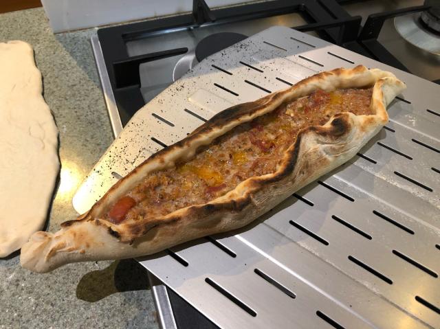 A lamb pide just out of the pizza oven. 