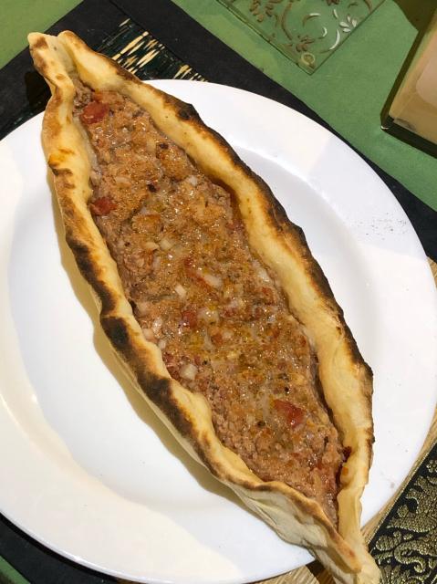 Lamb pide on a plate