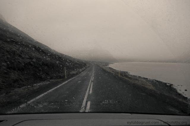 road with fog over the fjord