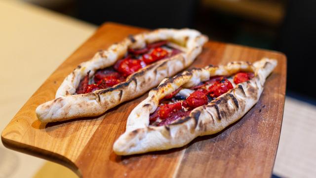 Two turkish style pides (like a pizza, but the sides are folder up to make a canoe).
