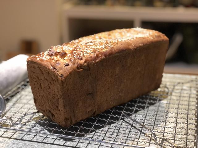 Rectangular fruit loaf containing spices, dried apple, apricot, dates and almonds. 