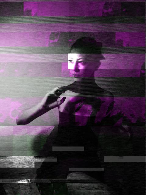 A woman is sitting surrounded by purple visual noise as she stares away raising her right arm. 