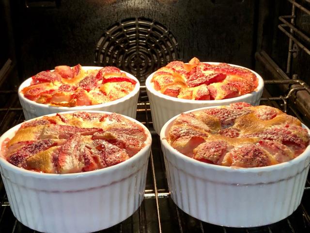 Four individual strawberry clafoutis. 